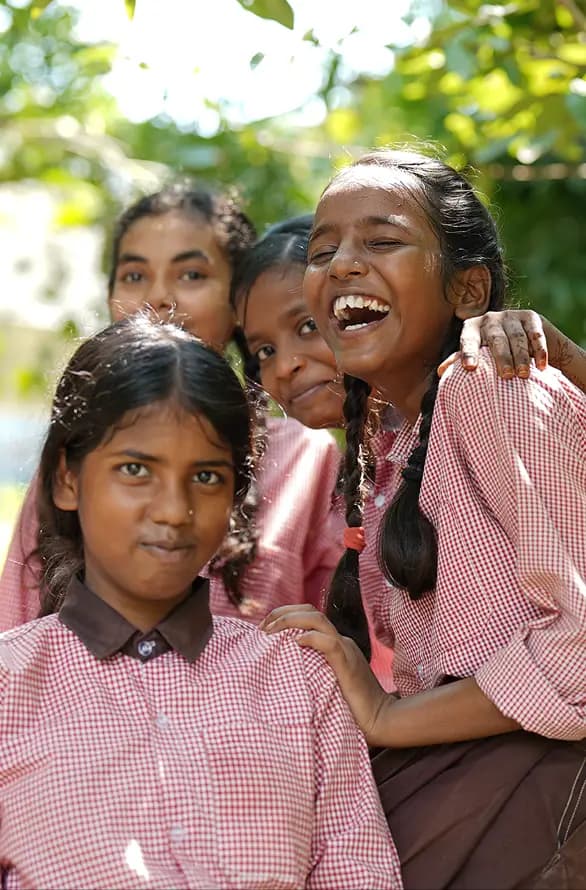 Schoolgirls laughing together