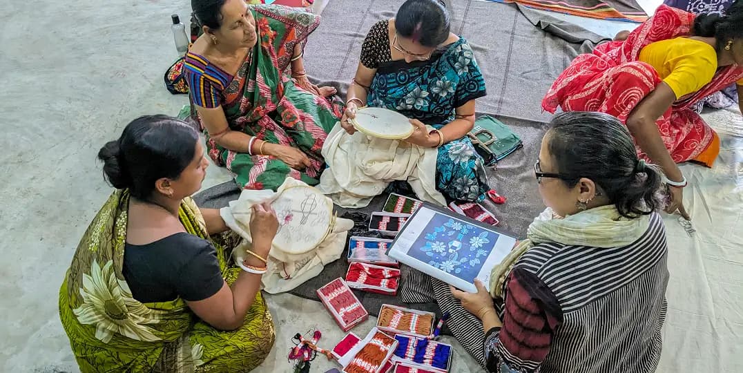 Women artisans collaborate on handmade textile work