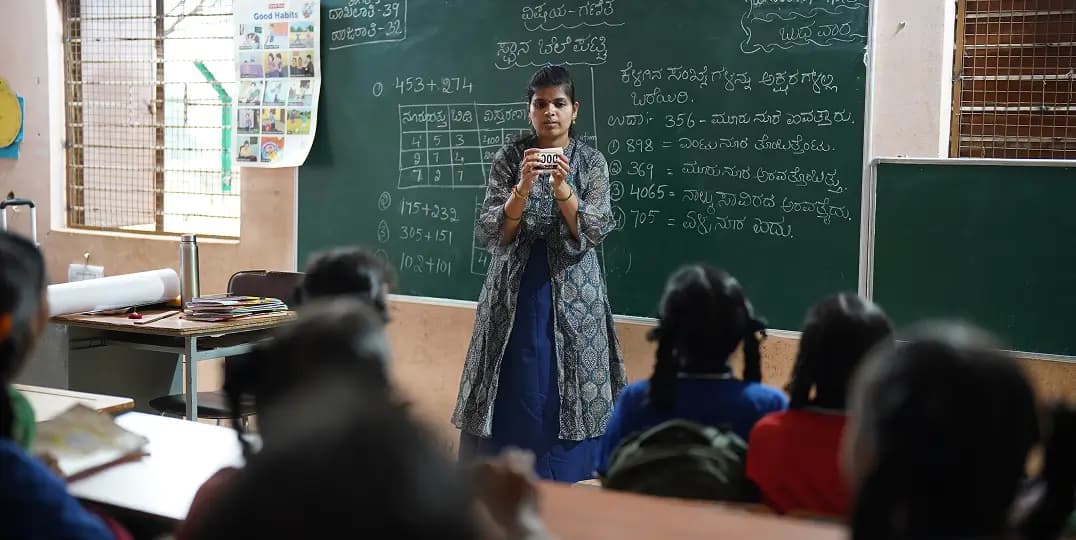 Teacher teaching a classroom of attentive students
